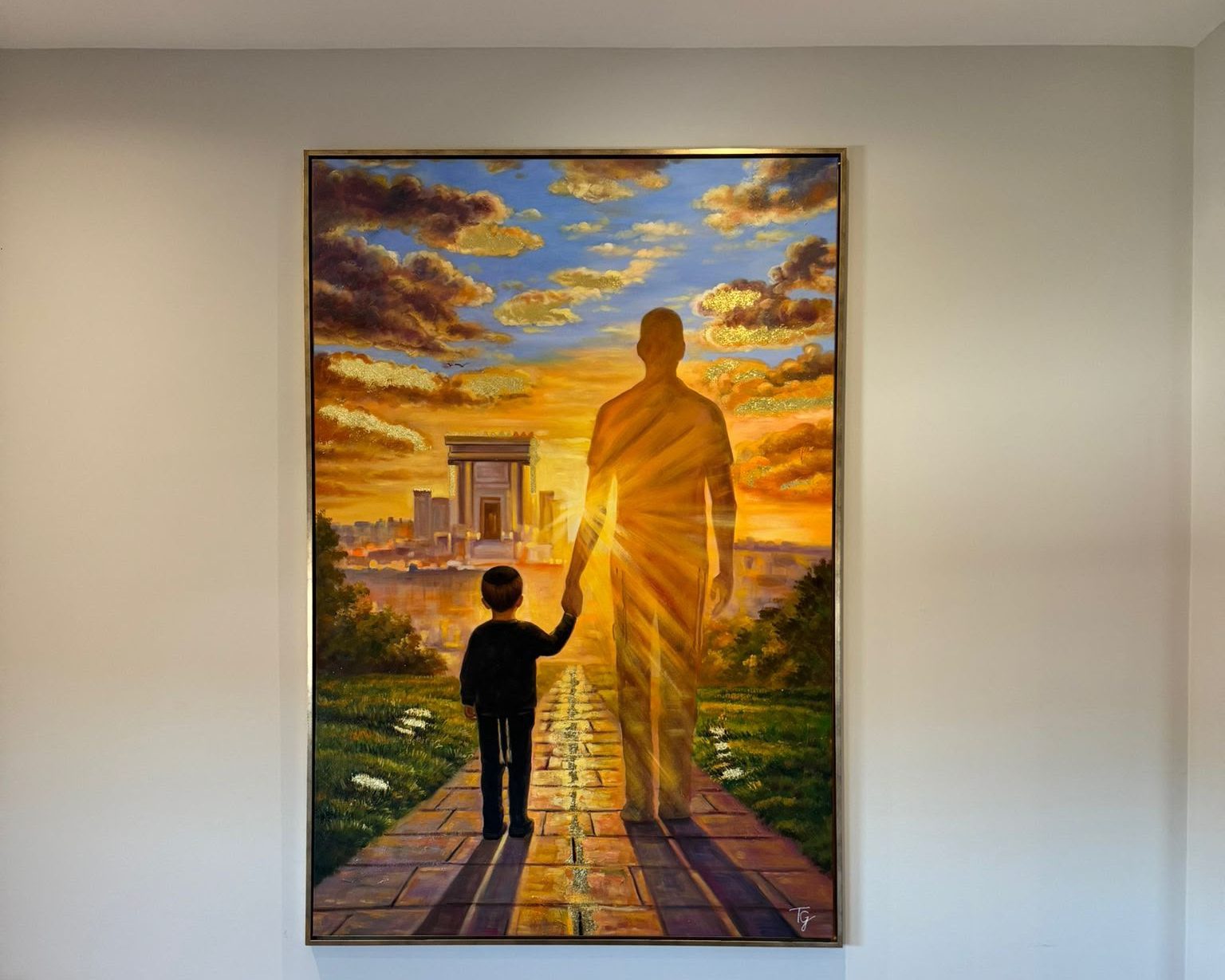 Father and child painting framed on a wall